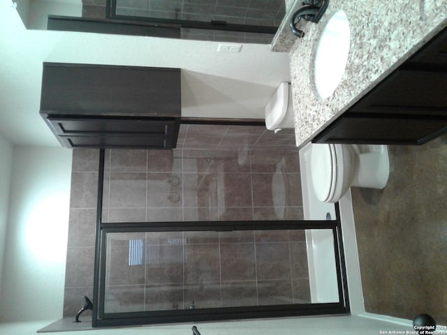 bathroom featuring toilet and vanity