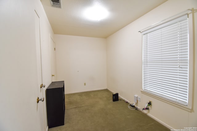 unfurnished room with light colored carpet