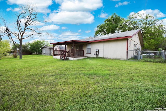 back of house with a yard