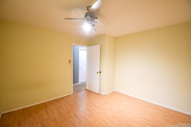 unfurnished room with ceiling fan and light wood-type flooring