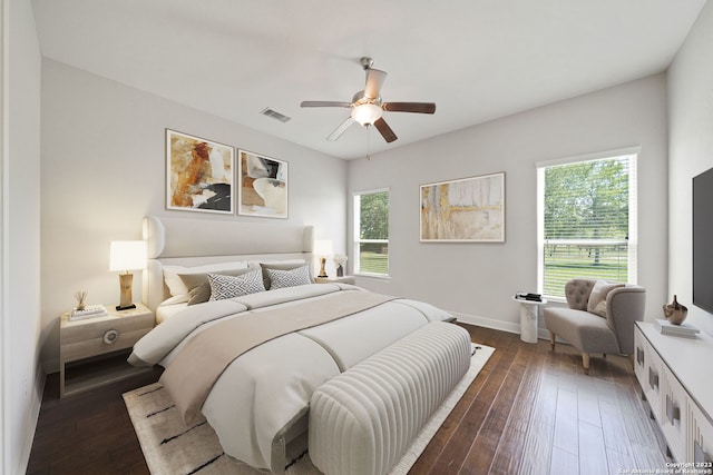 bedroom featuring ceiling fan and dark wood-type flooring