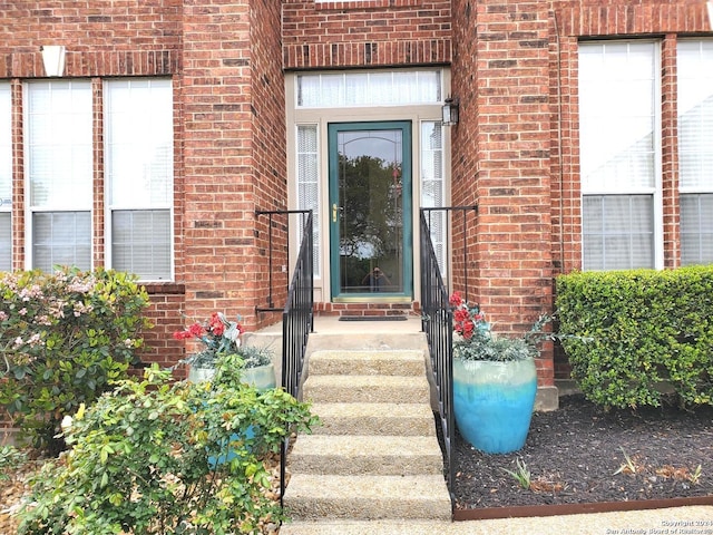 entrance to property with brick siding