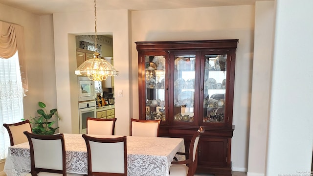 dining room with a chandelier