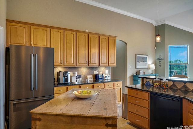 kitchen with pendant lighting, a center island, light tile flooring, tasteful backsplash, and stainless steel refrigerator