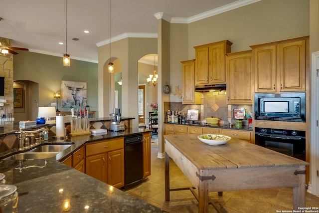 kitchen with dark stone counters, ceiling fan with notable chandelier, black appliances, hanging light fixtures, and sink