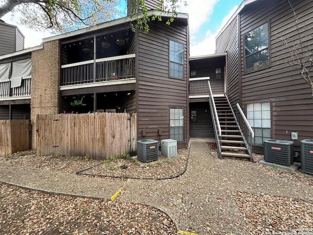 back of house featuring central air condition unit