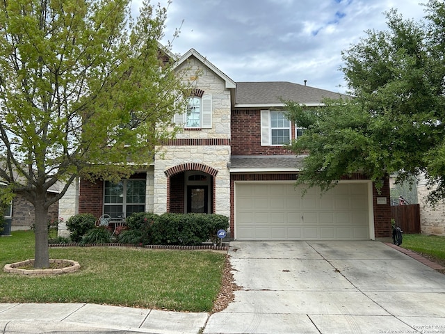 view of front of property with a front lawn and a garage