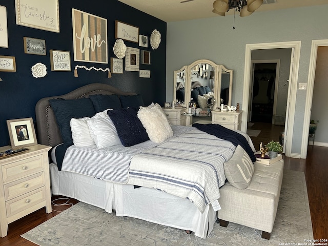 bedroom featuring dark hardwood / wood-style floors and ceiling fan