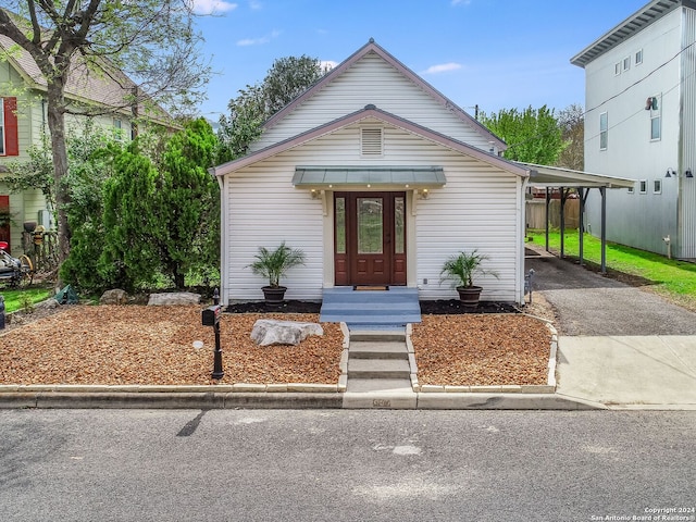 view of front of home with a carport