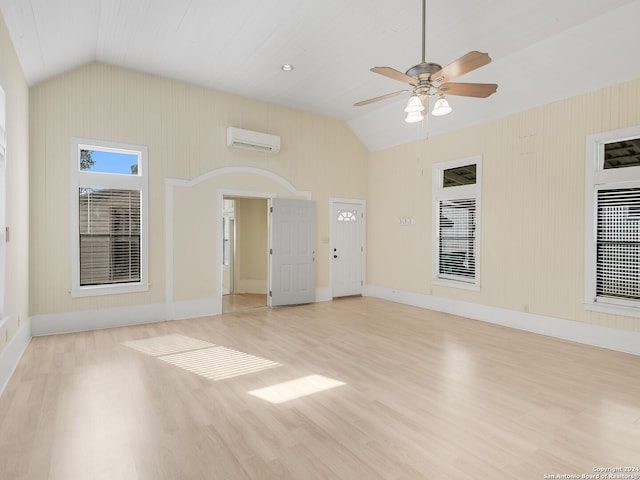 spare room with light hardwood / wood-style floors, ceiling fan, and lofted ceiling