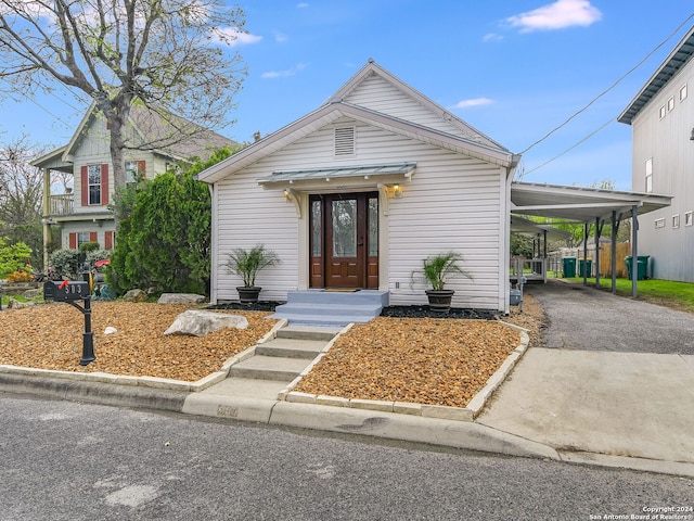 view of front of home with a carport