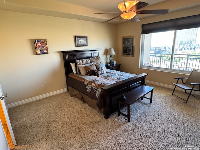 bedroom with light colored carpet and ceiling fan