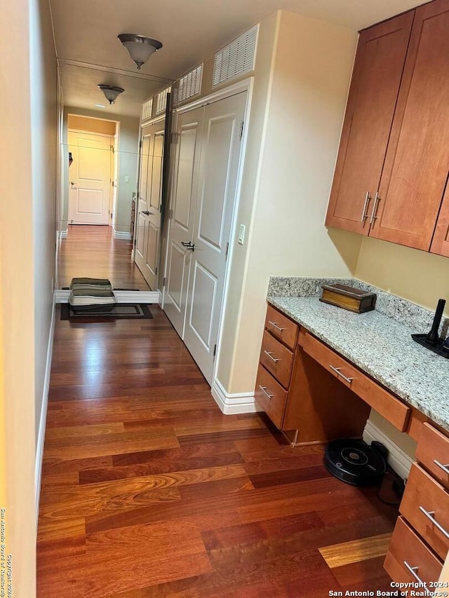 hallway featuring dark hardwood / wood-style floors