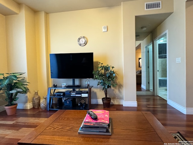 living room featuring dark wood-type flooring