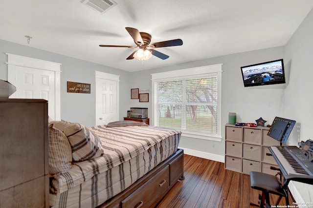 bedroom featuring dark hardwood / wood-style flooring and ceiling fan