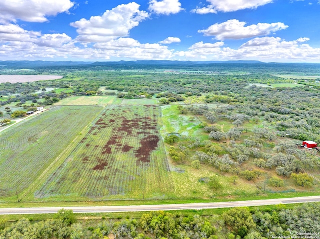 birds eye view of property with a rural view