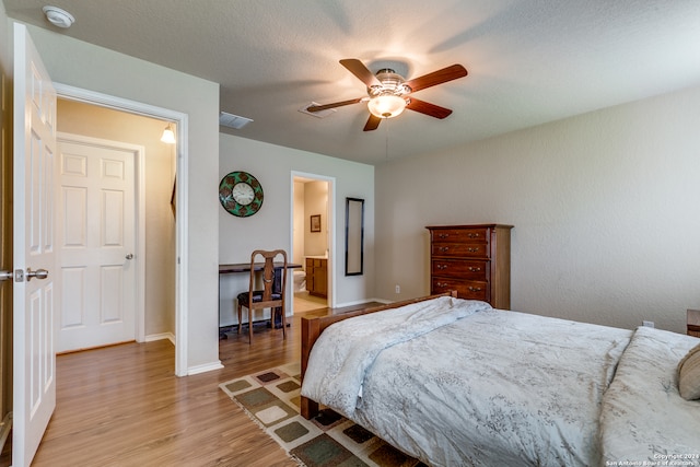 bedroom with light hardwood / wood-style floors and ceiling fan