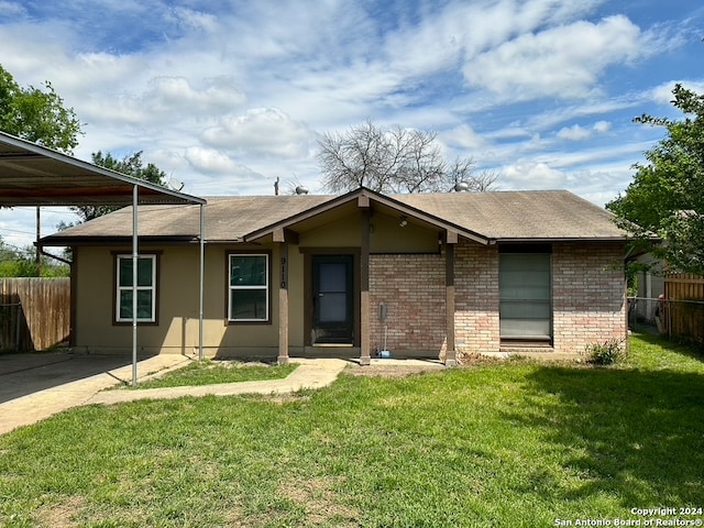 ranch-style home featuring a front yard