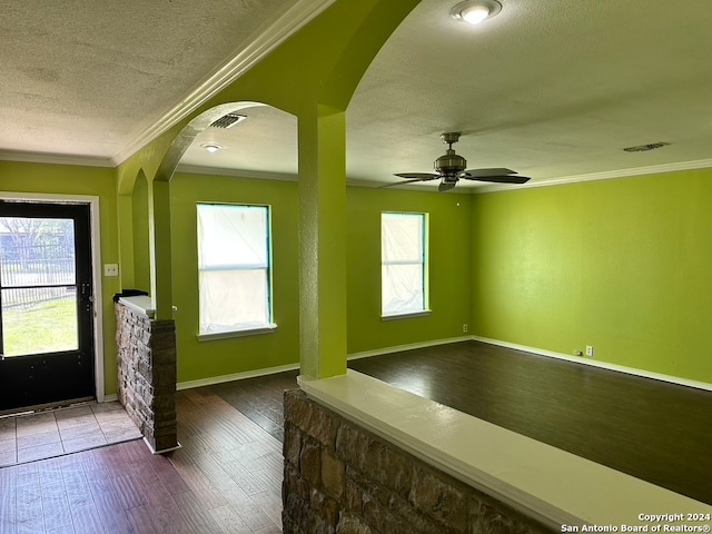 unfurnished room with ceiling fan, dark hardwood / wood-style floors, and a healthy amount of sunlight