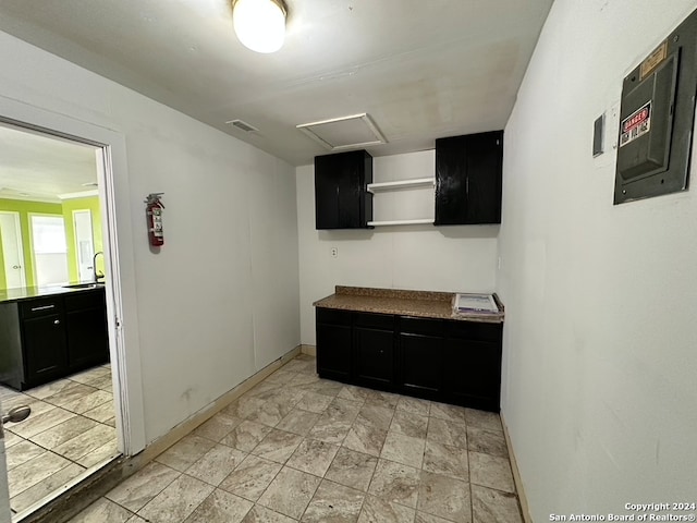 kitchen with light tile floors and sink