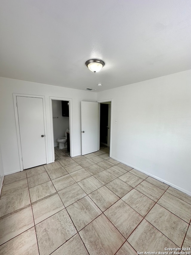 view of tiled spare room