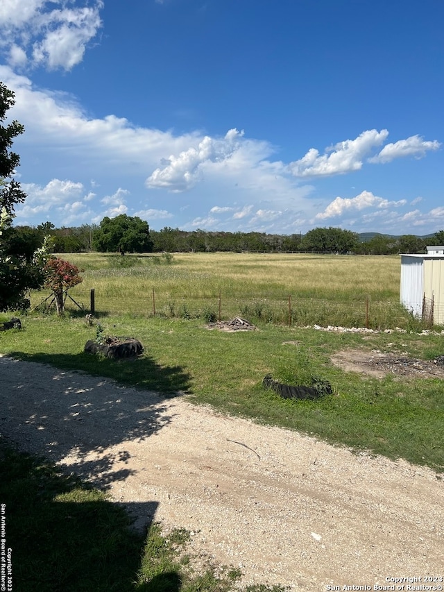 view of yard with a rural view