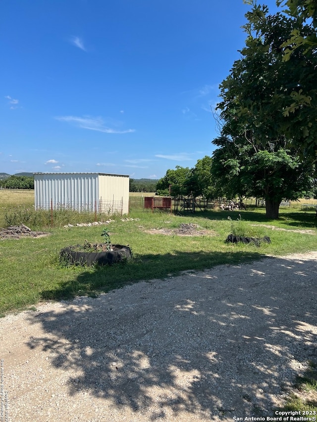 exterior space with a shed