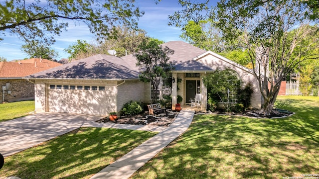 view of front of house with a front lawn and a garage