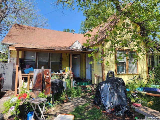 view of front of house with a sunroom