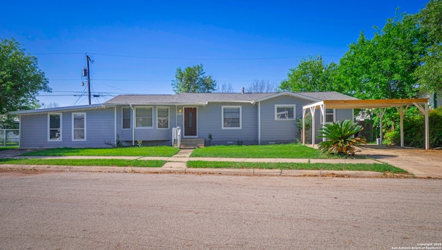 single story home with a front lawn and a carport