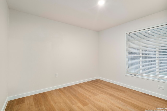 empty room with light hardwood / wood-style floors