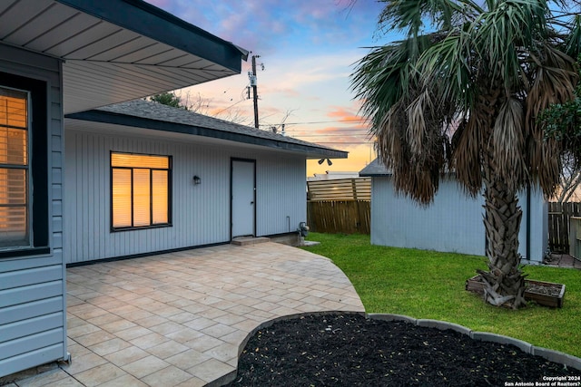 patio terrace at dusk with a yard