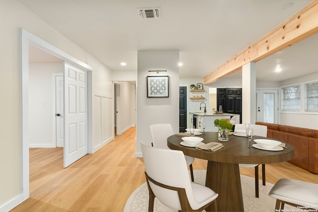 dining area featuring light wood-type flooring