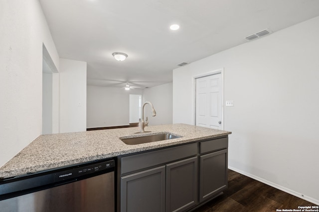 kitchen featuring light stone counters, stainless steel dishwasher, ceiling fan, and dark hardwood / wood-style flooring