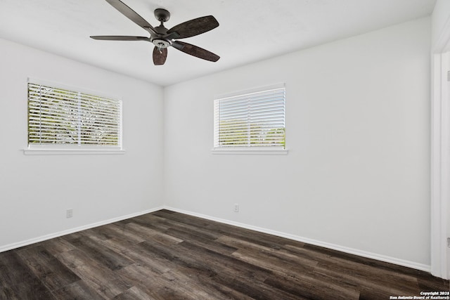 unfurnished room featuring dark hardwood / wood-style floors and ceiling fan