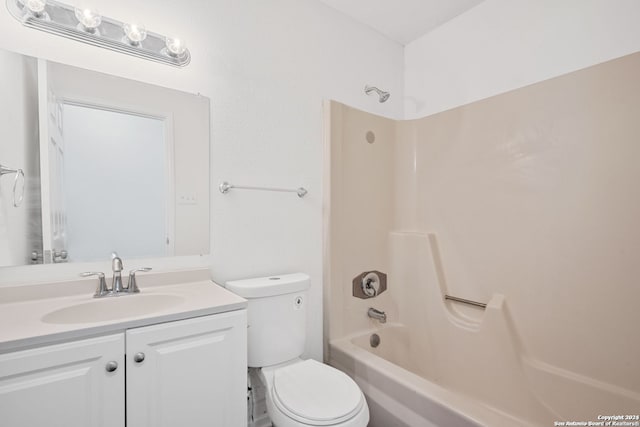 full bathroom with vanity, shower / tub combination, and toilet