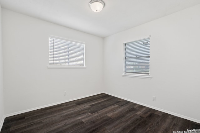 empty room featuring dark hardwood / wood-style floors