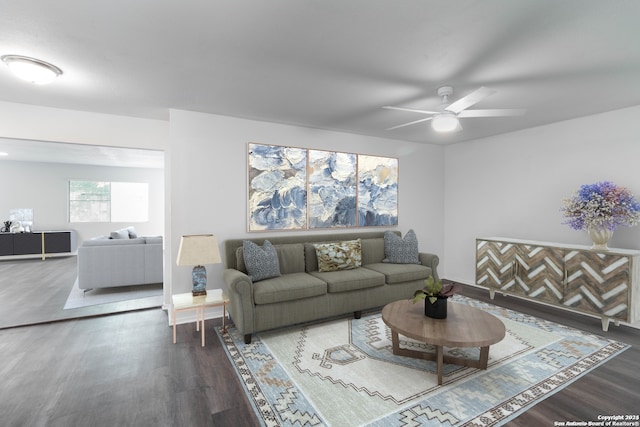 living room featuring dark hardwood / wood-style floors and ceiling fan