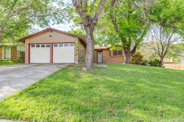 ranch-style house with a front lawn and a garage