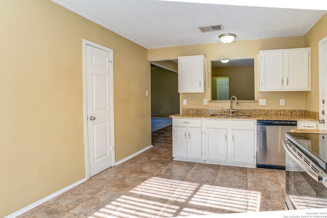 kitchen featuring sink, light tile floors, white cabinets, dishwasher, and light stone countertops