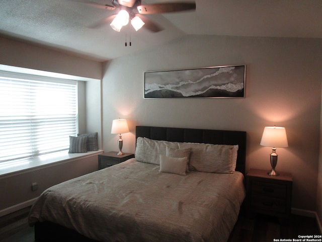 bedroom with ceiling fan and lofted ceiling