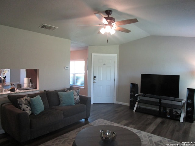 living room with vaulted ceiling, ceiling fan, and dark wood-type flooring