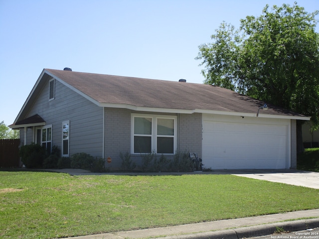 single story home with a front lawn and a garage