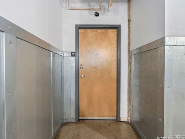 doorway featuring concrete flooring