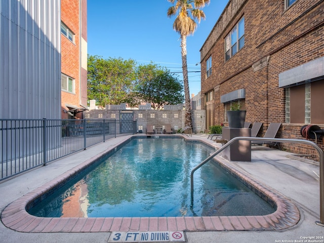 view of pool featuring a patio