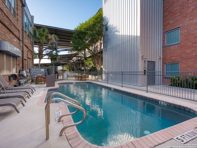 view of pool featuring a patio area