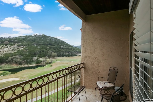 balcony featuring a mountain view