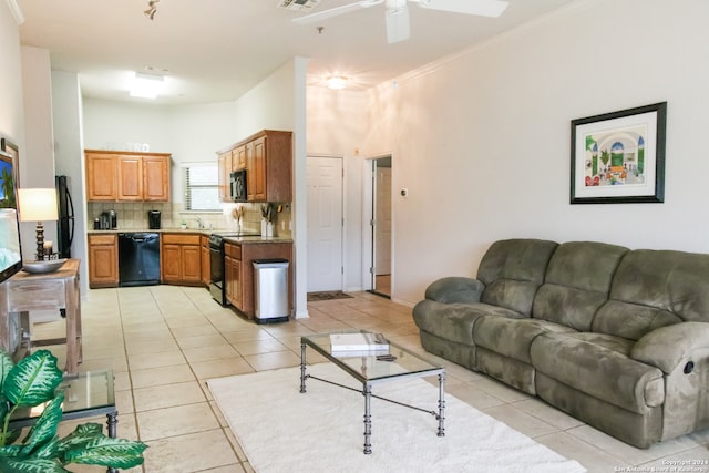 living room featuring ornamental molding, light tile flooring, and ceiling fan