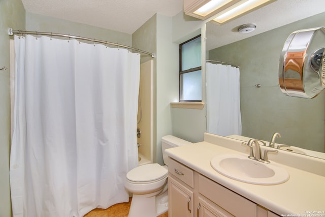 full bathroom with a textured ceiling, shower / tub combo with curtain, toilet, and vanity