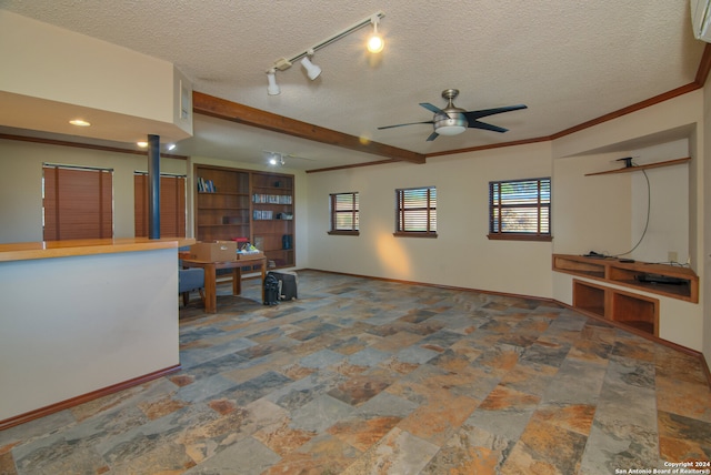 living room with tile floors, a textured ceiling, track lighting, and ceiling fan